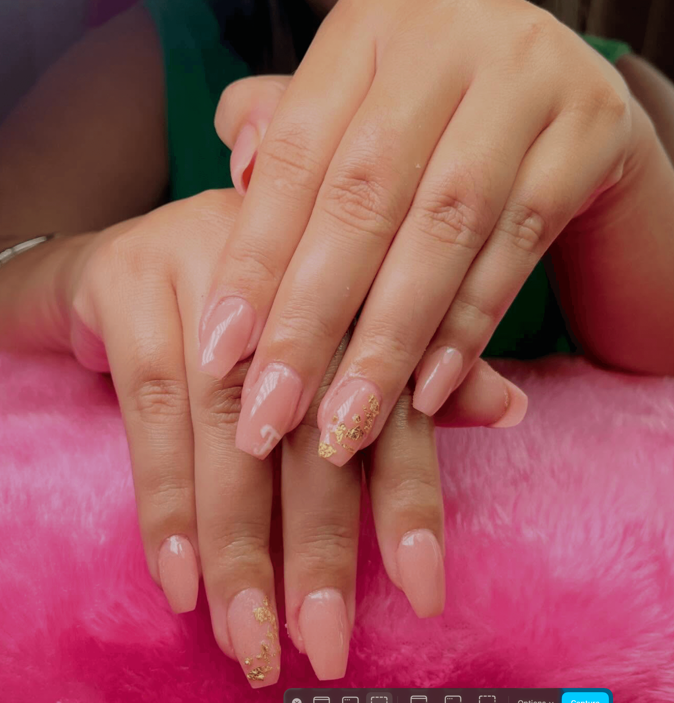 Peach-pink coffin nails with gold foil and a floral motif